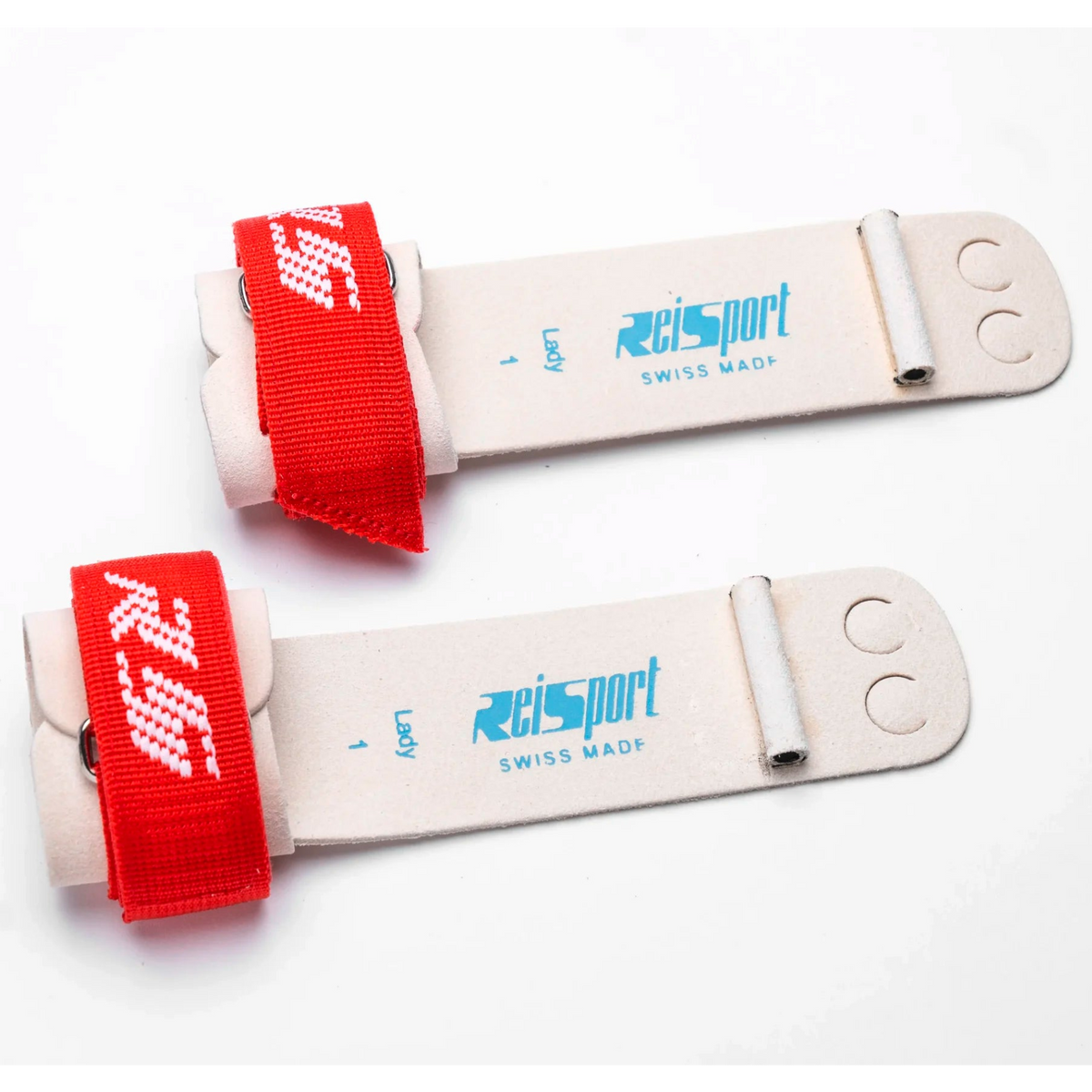 Two white plastic strap components with red elastic bands and blue 'reisport SWISS MADE' branding, shown on a plain white background.